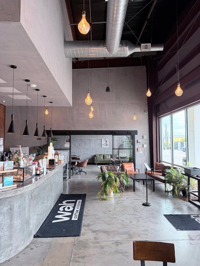 Bar and lounge area with ductwork ceiling and floor mat