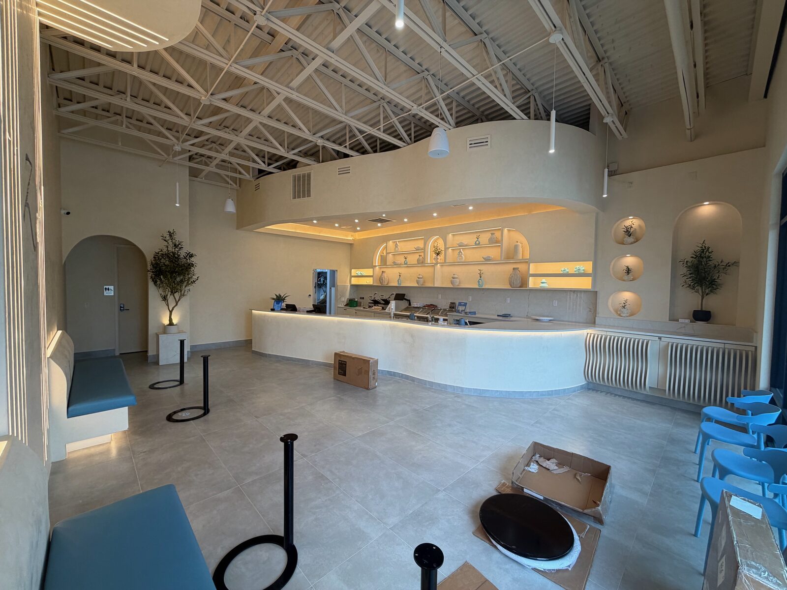 Z Cafe interior with curved counter and arched shelving